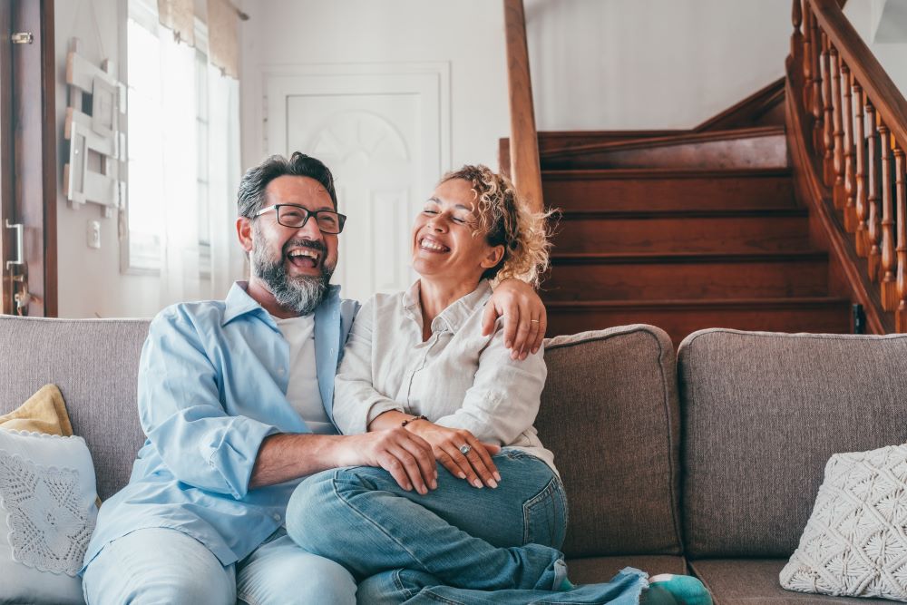 A couple sitting on the couch.